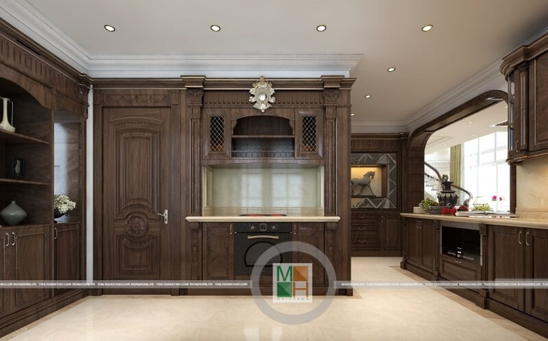 Thiết kế phòng bếp chung cư cao cấp có hệ tủ bếp gỗ tự nhiên nâu trầm với kiểu dáng tinh tế, nghệ thuật mang đến vẻ đẹp sang trọng, đẳng cấp cho căn phòng.